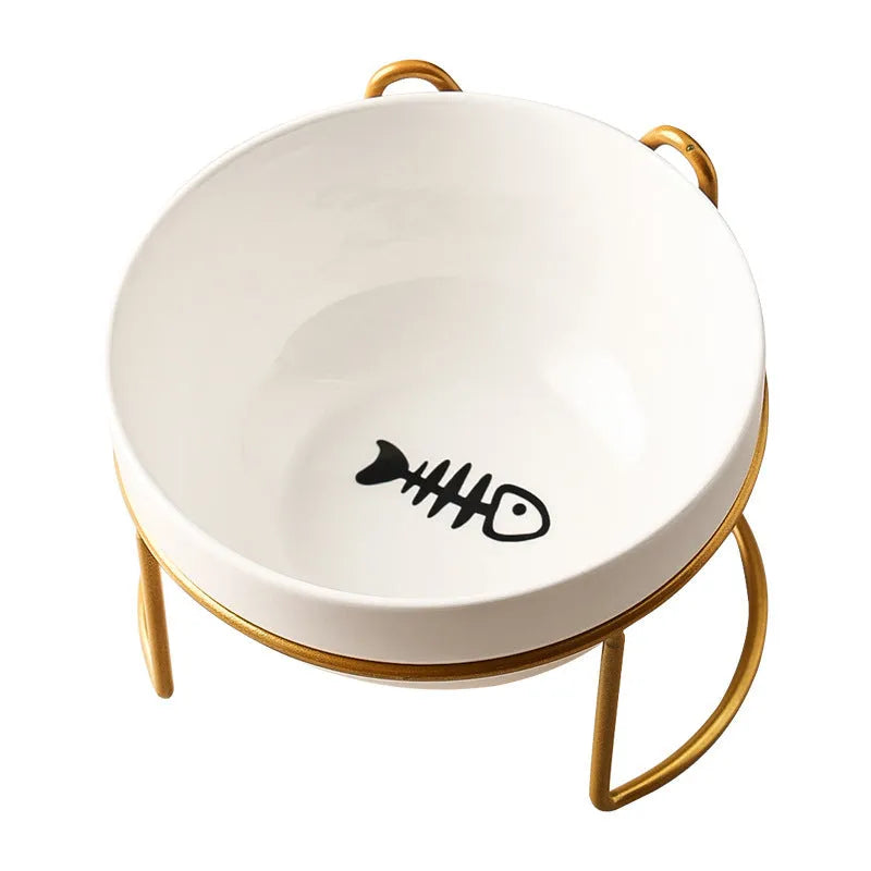 Ceramic cat bowl with iron frame stand showing cat paw print pattern and gold metal finish