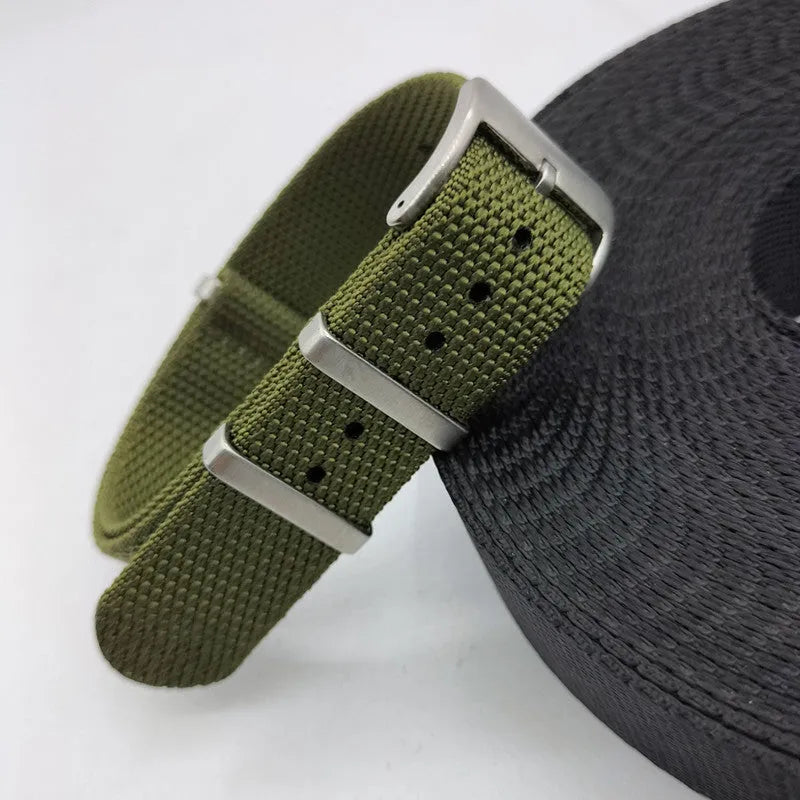 Nylon quick-release watch strap in army green colour showing integrated spring bars