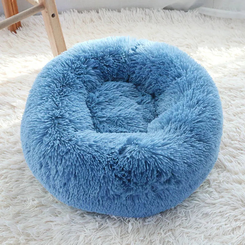Plush pet nest in apricot colour on floor, soft cloth circular dog bed 40cm diameter indoor use