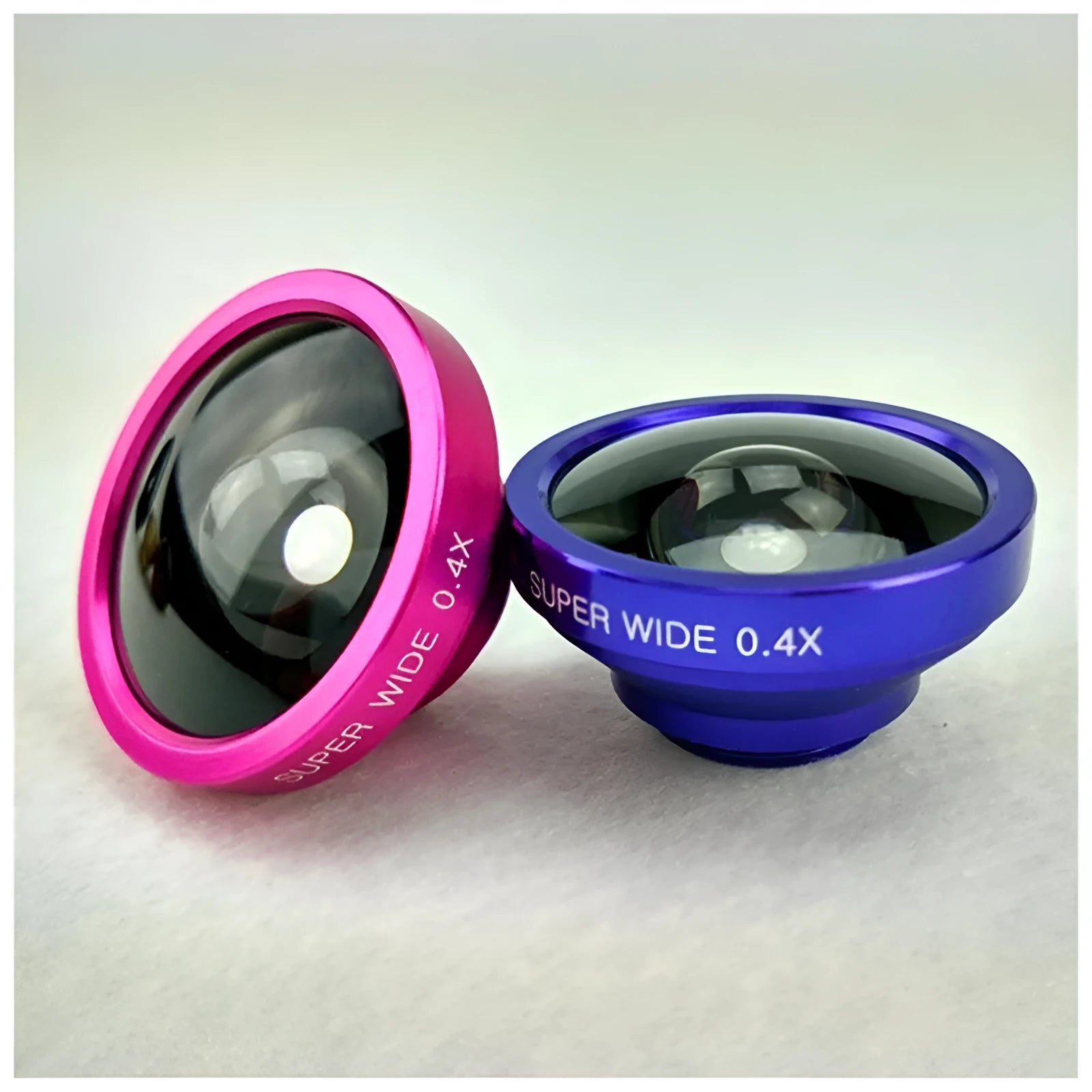 Three-in-one smartphone camera lens kit showing fisheye, wide-angle, and macro lenses with a universal clip.
