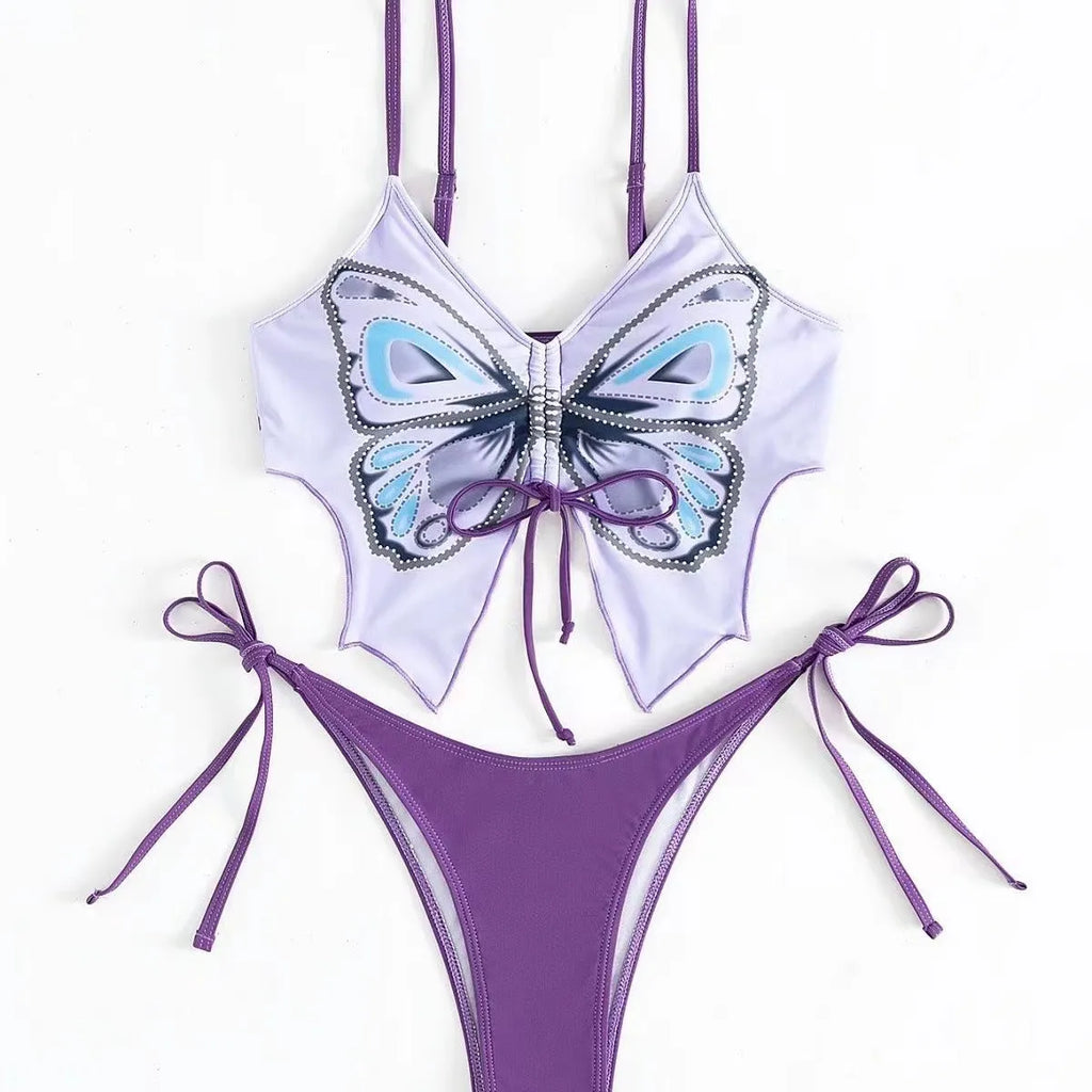 Women's purple bow style split bikini swimsuit with sleeveless top and briefs.