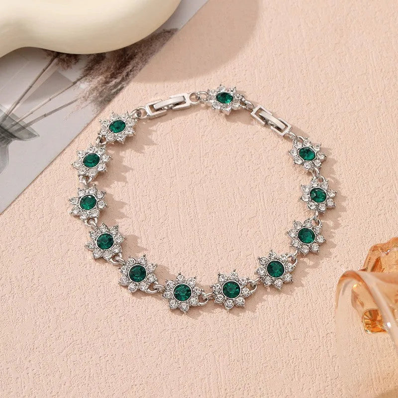 Floral-shaped zinc alloy bracelet with electroplated finish in gold and silver colour options.