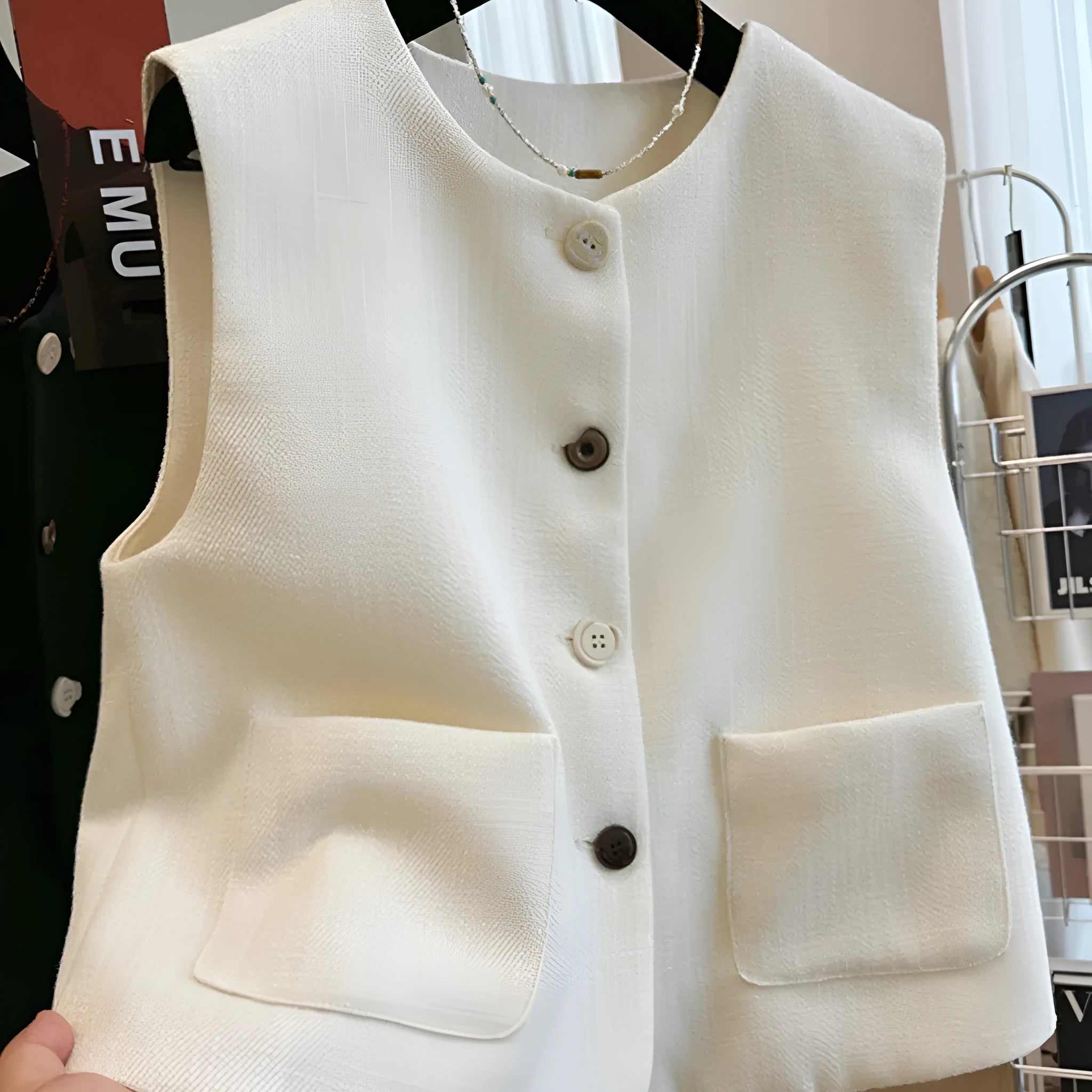 Women's round neck sleeveless vest in French bandage style, available in milky white and black colours