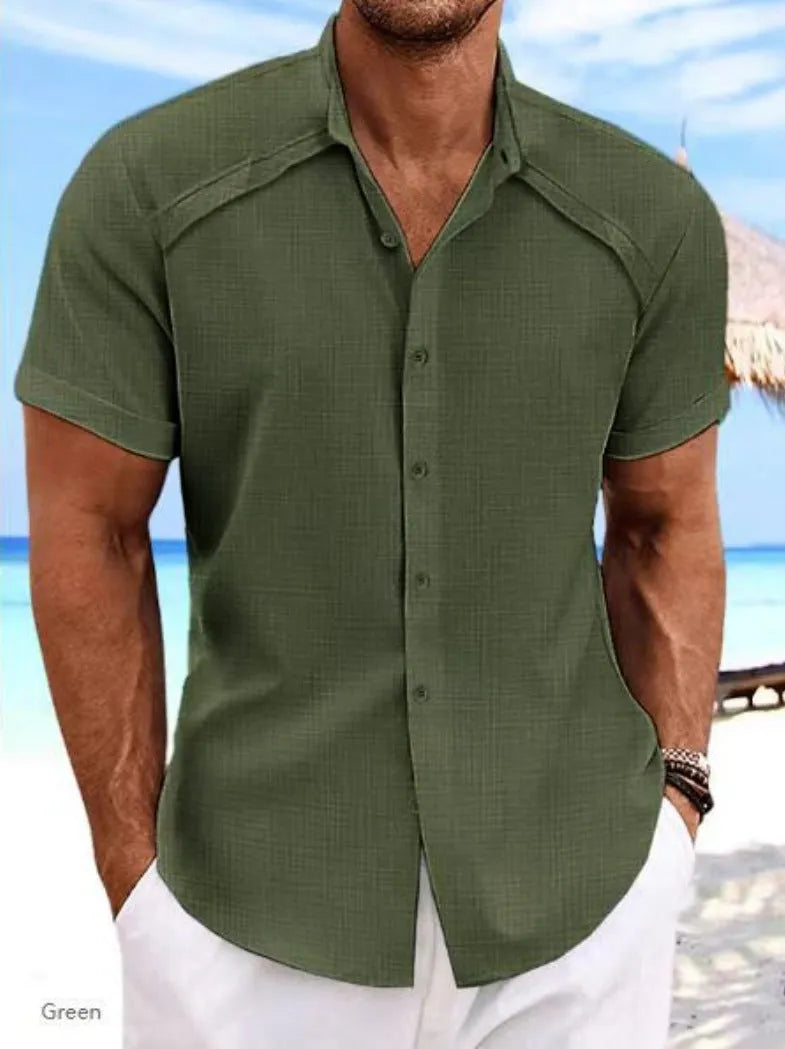 Hawaiian casual short sleeve solid colour shirt in a cotton blend fabric on a hanger.