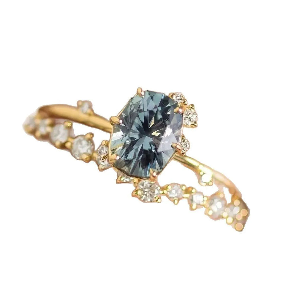 Gold electroplated women's ring with flower design featuring green zircon stones