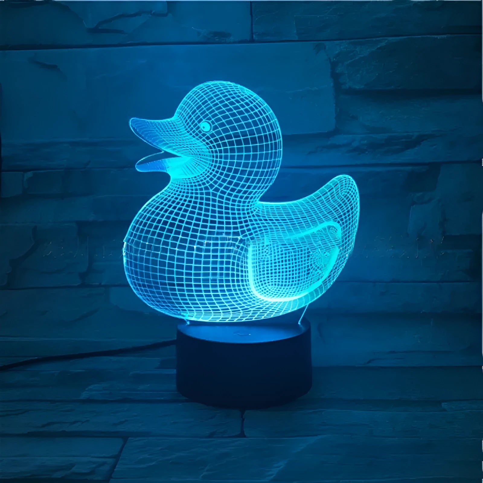 Little Yellow Duck 3D night light with acrylic panel on ABS base, showing remote control and USB cable.
