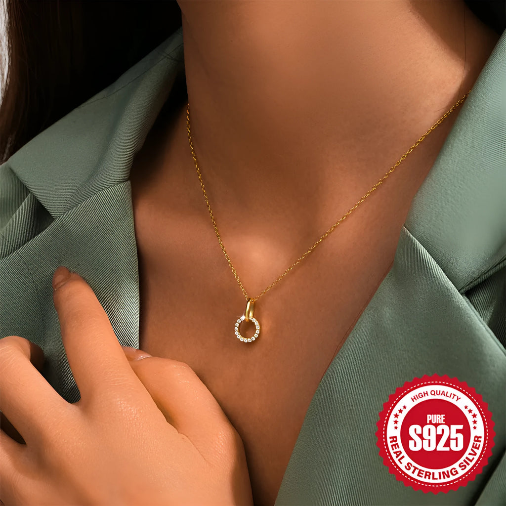 Gold-coloured geometric pendant on adjustable sterling silver clavicle chain necklace