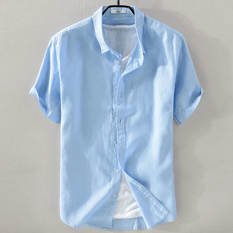 Men's loose fit short sleeve linen shirt in apricot colour on a hanger