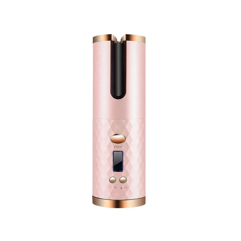 White portable automatic curling iron with a gold ceramic barrel and USB charging cable on a pink background.