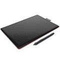 Wacom CTL-472 One by Wacom small drawing tablet with pressure pen and USB cable on desk