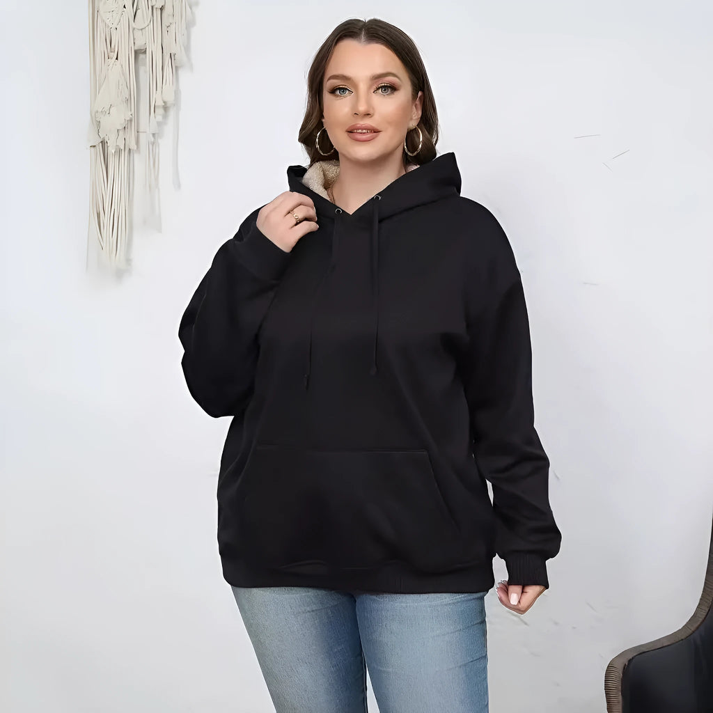 Women's loose grey hooded sweater with a 3D textured pattern on the front.