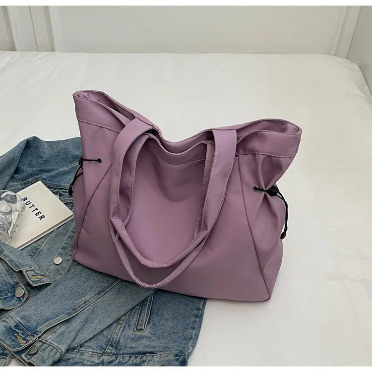 Soft Oxford cloth folding shoulder tote bag shown in available colour options