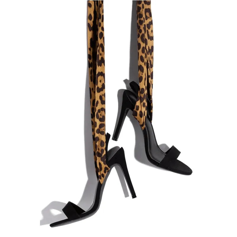 Light brown leopard print Roman style high heels with cross straps and super high heel
