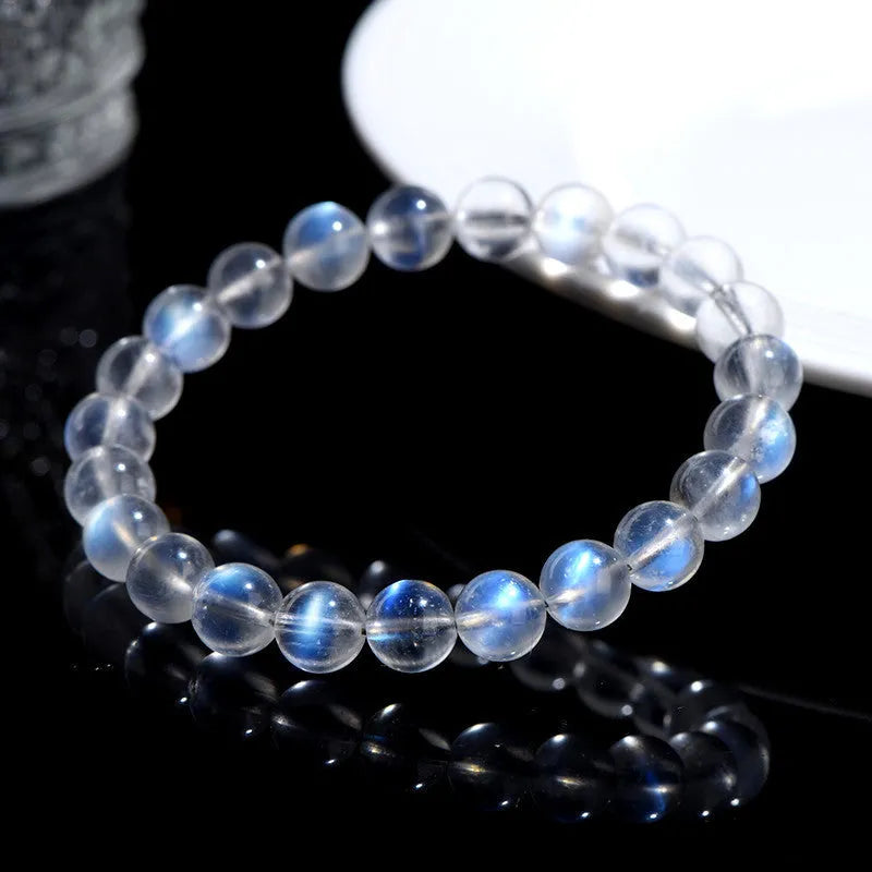 Natural cream crystal bracelet with blue moonlight design and polished beads