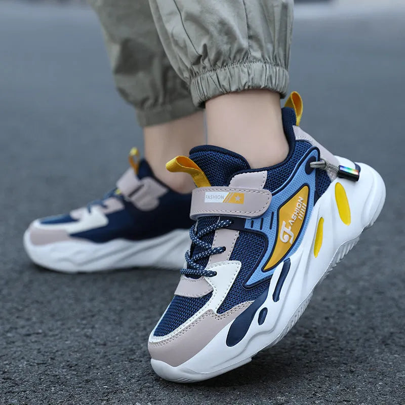 Boys' dark blue and black platform sports running shoes with Velcro strap and mesh upper.