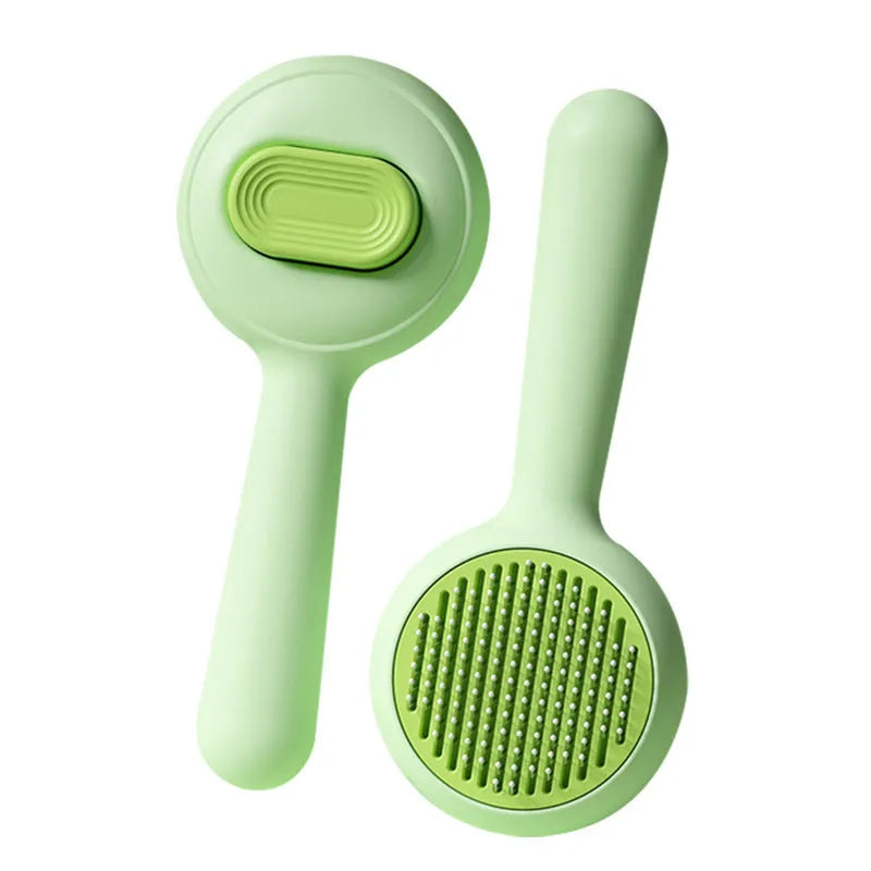 Green and yellow pet grooming brushes with stainless steel pins and non-slip handles on a white background.
