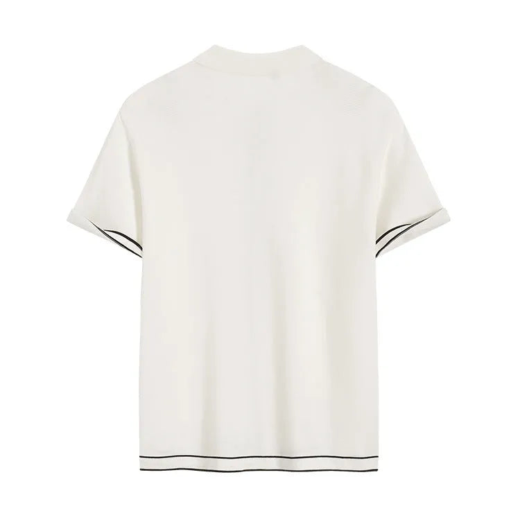 White women's short sleeve cardigan with dark contrast lapels on a front view.