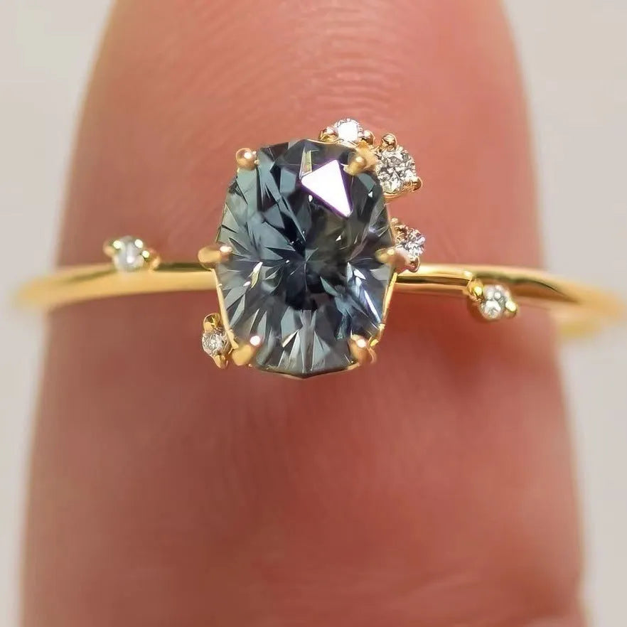 Gold electroplated women's ring with flower design featuring green zircon stones