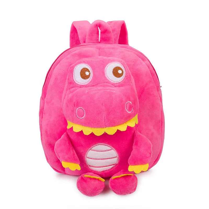 Soft blue plush dinosaur backpack for kids with embroidered character detail and a soft handle.