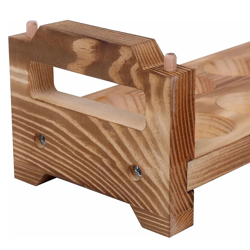 Solid wood egg storage rack in fire colour on a kitchen countertop