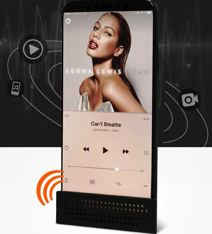 Compact black mobile phone amplifier bracket holding an iPhone on a desktop.