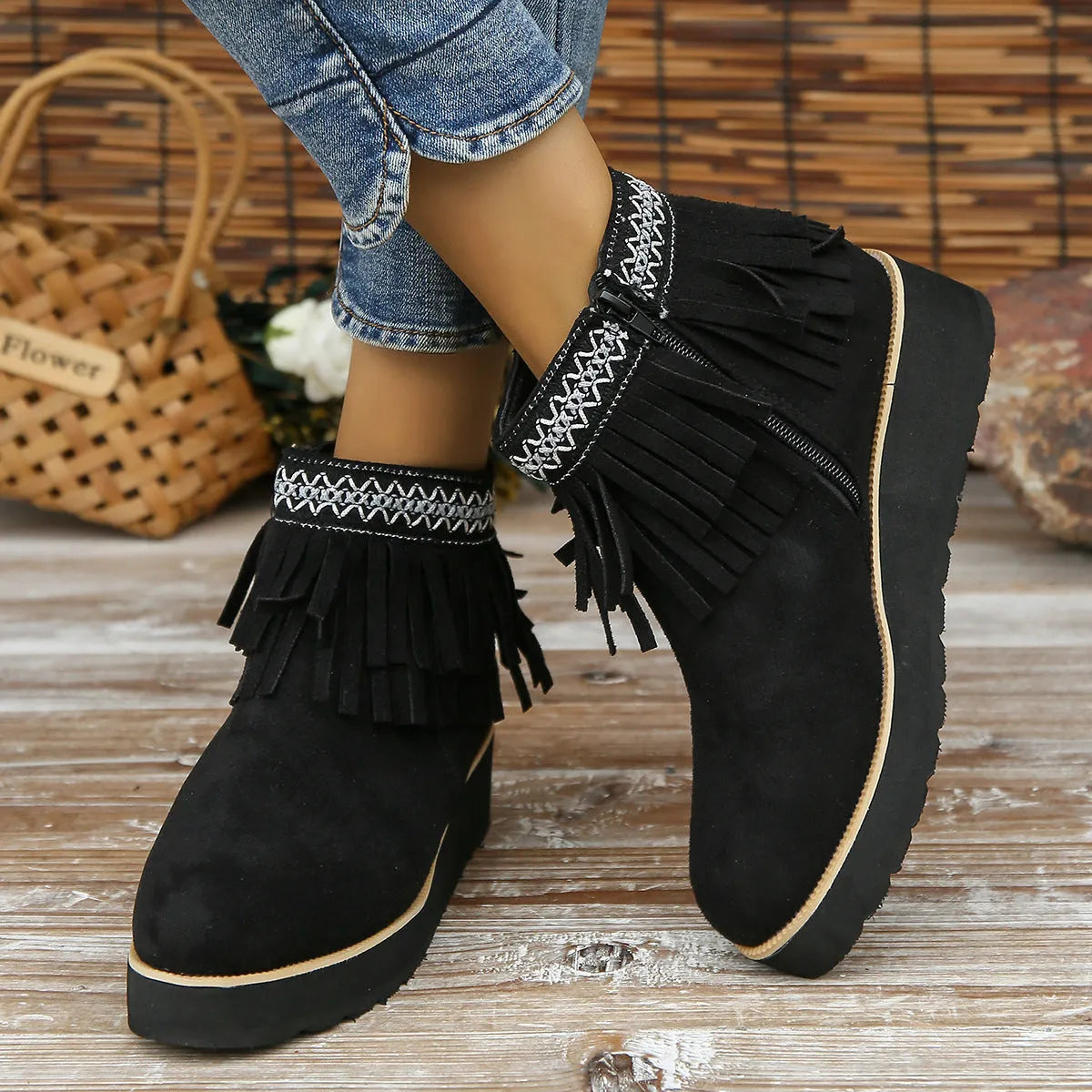 Women's dark brown suede wedge ankle boot with side zip, tassel, and thick rubber sole.