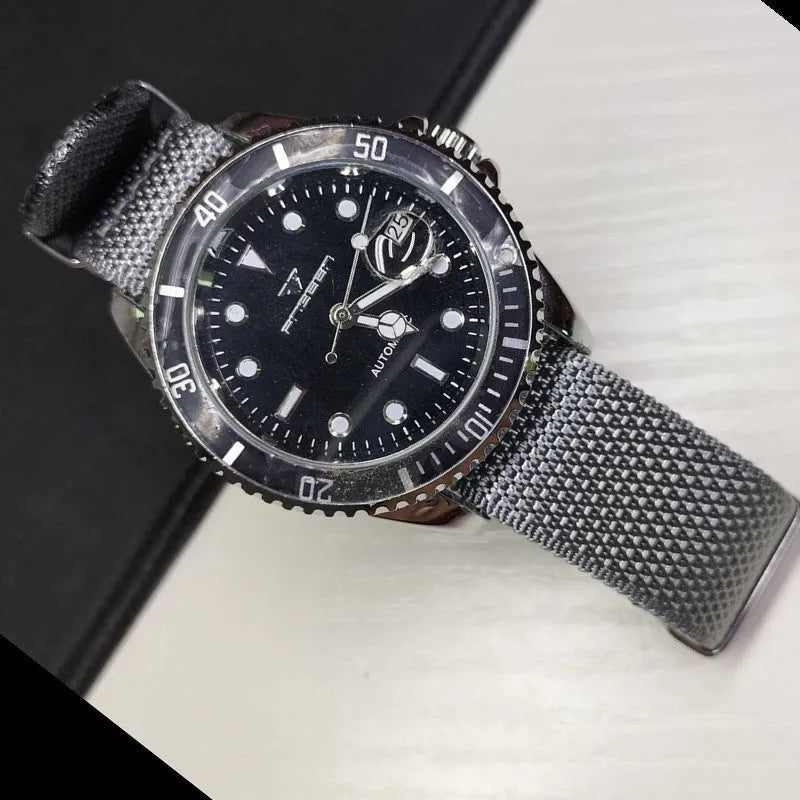 Nylon quick-release watch strap in army green colour showing integrated spring bars
