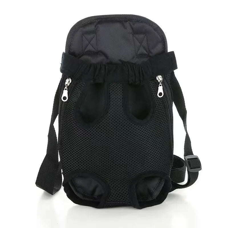 A small dog sitting in a breathable mesh carrier backpack worn on a person's front.