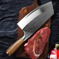 A 320mm stainless steel kitchen knife with a forged blade on a cutting board.