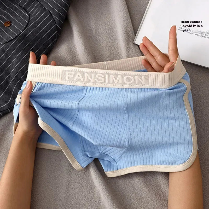 Three-pack of men's milk silk polyester boxer shorts in solid colours on a white background