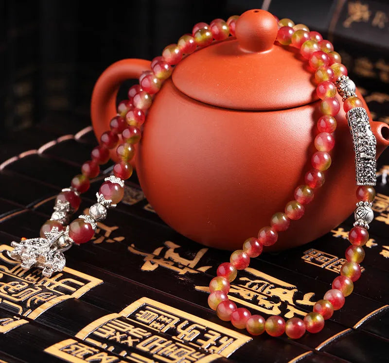 Watermelon crystal bracelet with Chinese knot fastening in 6mm or 8mm style options