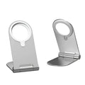Silver vertical adjustable magnetic phone bracket for iPhone 12 on a flat surface.