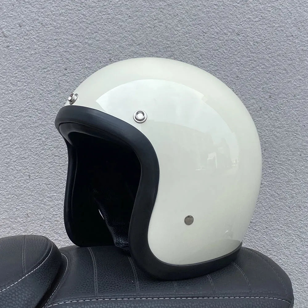 Retro-style half helmet for motorcycles with a fibreglass shell shown in a cement grey colour.