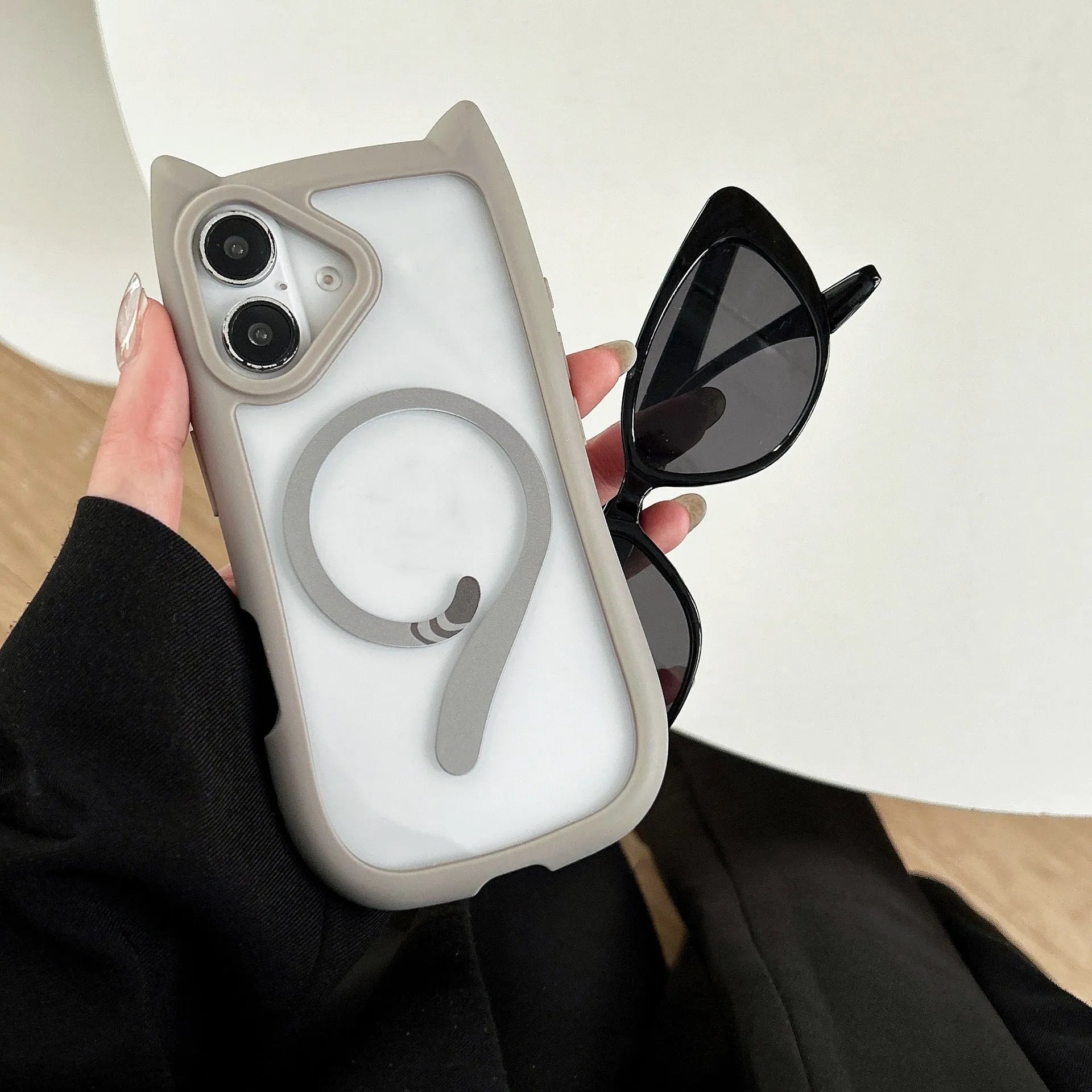 Clear acrylic and TPU two-layer phone case for iPhone 17 models on a table