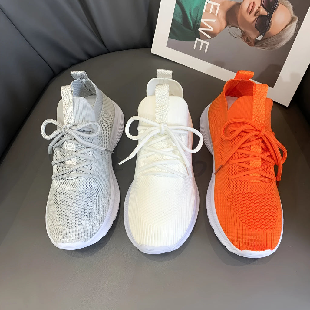 Women's mesh running shoes in creamy white with English muffin heel detail