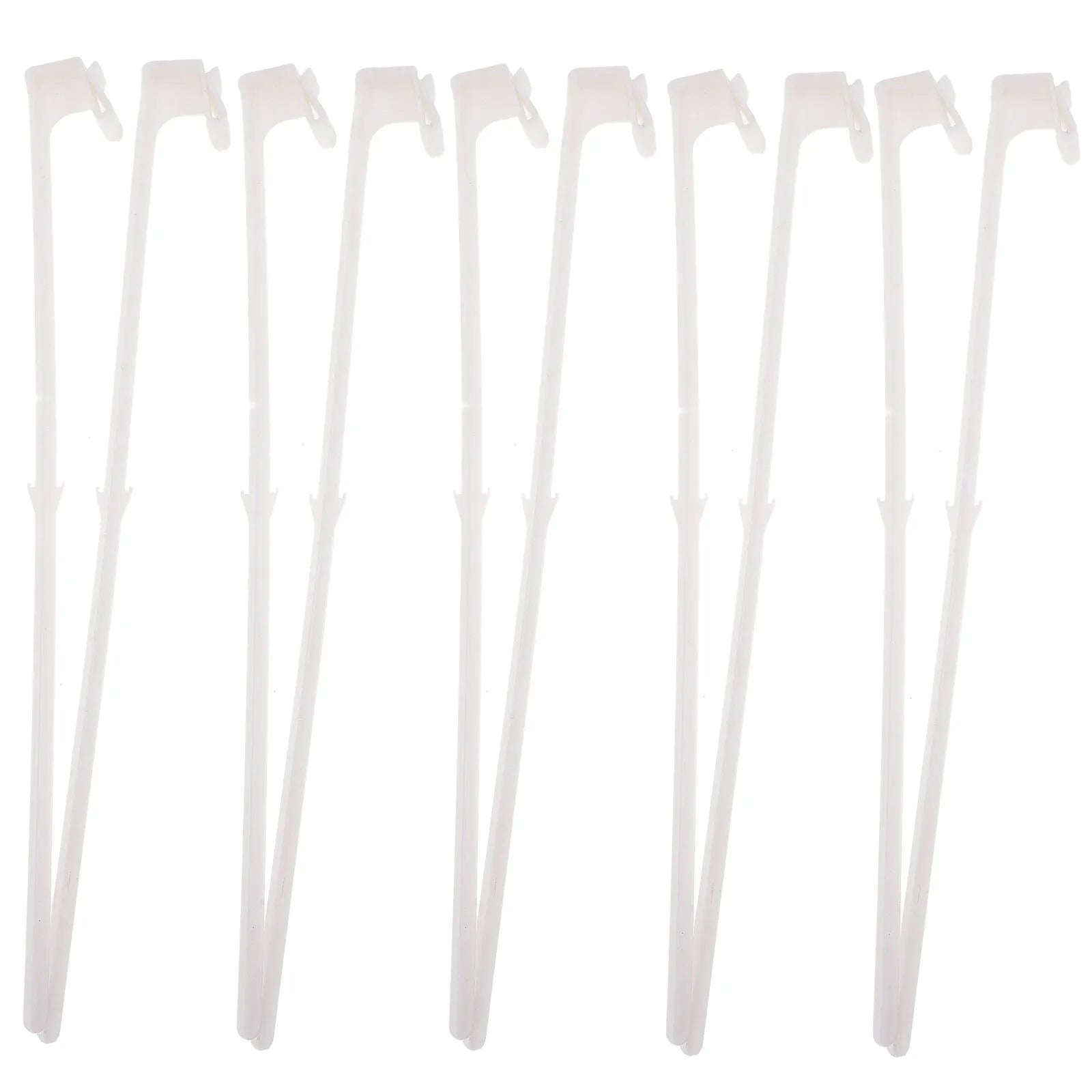 Ten white plastic car window flag pole holder clips on a flat surface.