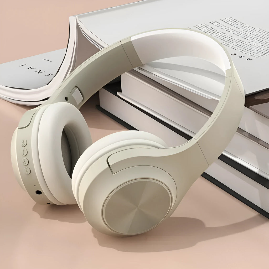 Creative wireless Bluetooth headset in chalk black, ivory white, or youth green colour on a charging stand