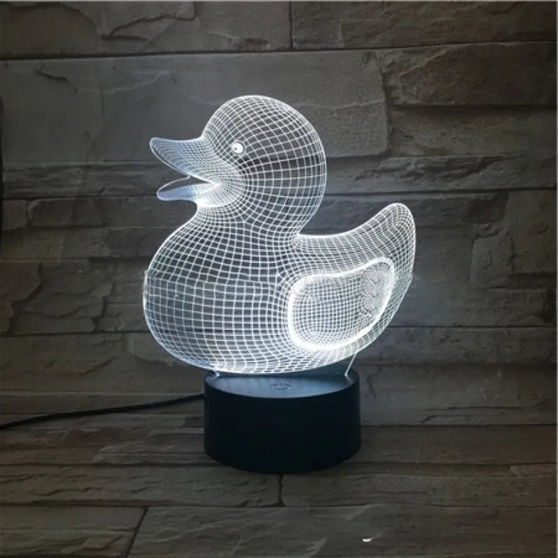 Little Yellow Duck 3D night light with acrylic panel on ABS base, showing remote control and USB cable.