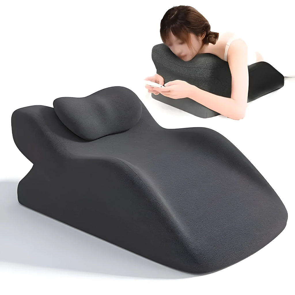 Ergonomic stomach sleeper pillow for reading in bed, shown in blue colour
