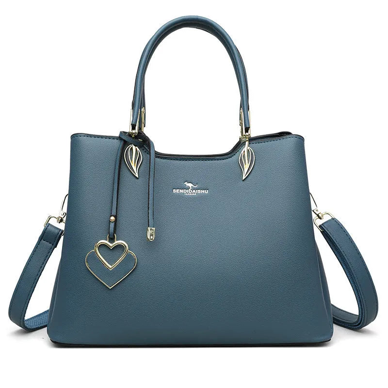 Women's black PU leather shoulder messenger bag with multi-layer compartments and visible stitching details