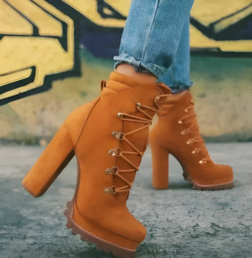 Women's suede ankle boots with thick heel in Roman style, showing decorative rivets and available in four colours