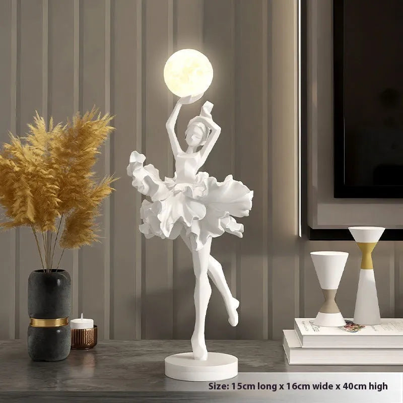 Small resin night light ornament in black gold colour with USB charging cable