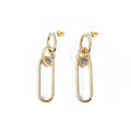 Geometric sterling silver needle hoop earrings with ring and line design on a white background.