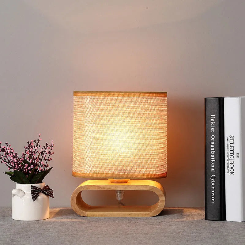 Nordic Japanese bedside table lamp with rubber wood holder, Φ170mm by H230mm, on a nightstand