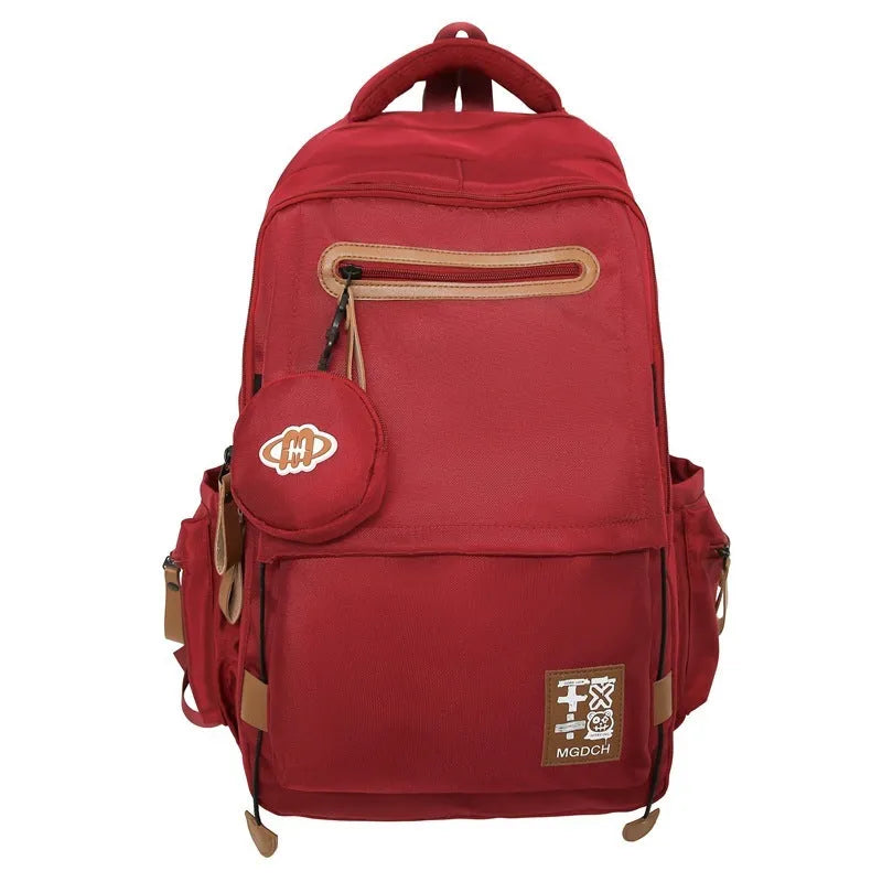 Large-capacity nylon school backpack for middle school students in solid colour with curved shoulder straps