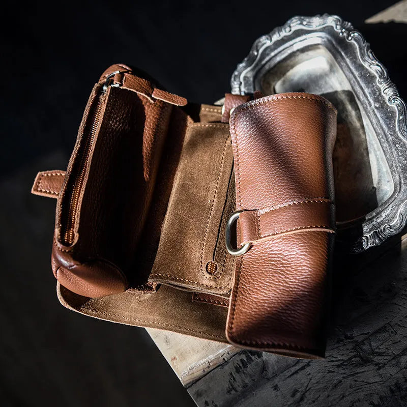 Handmade dark brown leather bifold wallet with tape extraction closure showing 20cm width