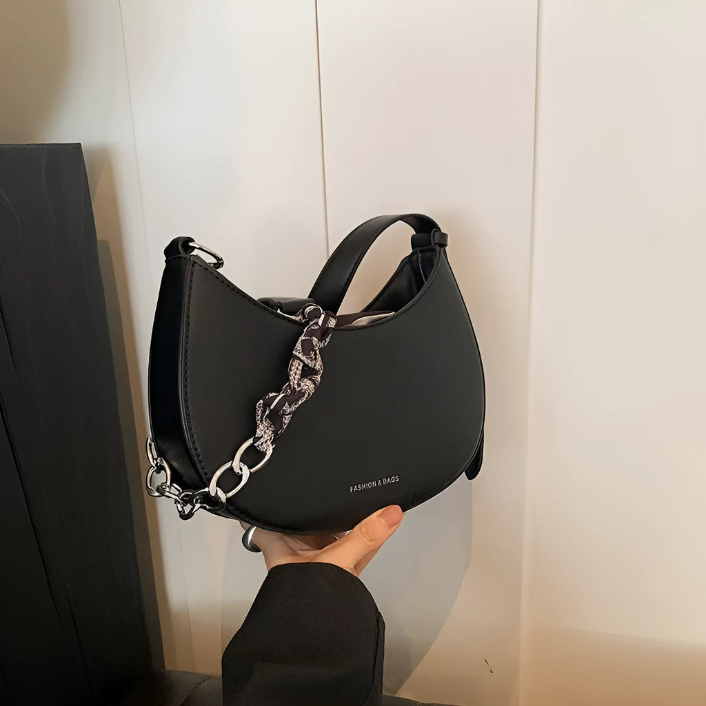 Small PU leather saddle bag on a flat surface, available in black, brown, coffee, green, khaki, and white