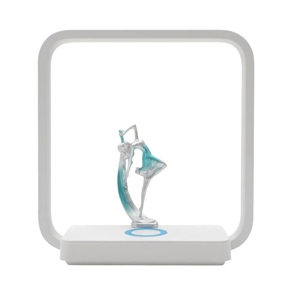 Atmosphere table lamp with wireless phone charger in blue light setting on a bedside table, 25cm tall