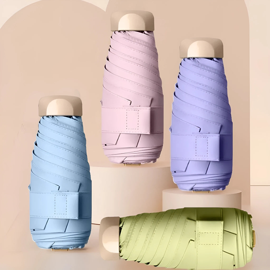 Compact five-fold sun umbrella with a gradient vinyl-laminated canopy and an alloy frame.