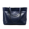 Women's wax cowhide leather handbag with horizontal silhouette and cross-body strap